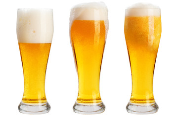 Glass of cold beer with foam, clipping path, bubbles in a drink, on a white background, isolated
