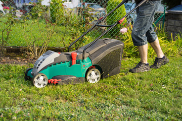 man with a lawn mower, gardening