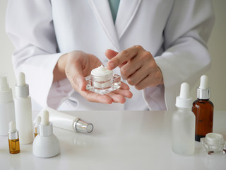 the scientist,dermatologist testing the organic natural product in the laboratory.research and...
