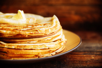 Pancakes with banana, nuts and honey. Traditional Russian cuisine. Maslenitsa. Dessert.