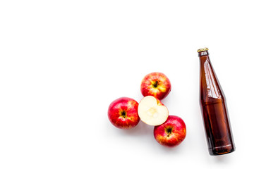 Apple cider. Low-alcoholic beveradge in dark bottle on white background top view copy space