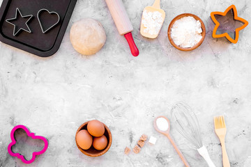Make dough. Ingedients flour, eggs near cookware on grey background top view cpy space