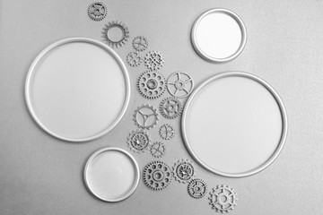 Silver gears with a round frame with a place for designer's text