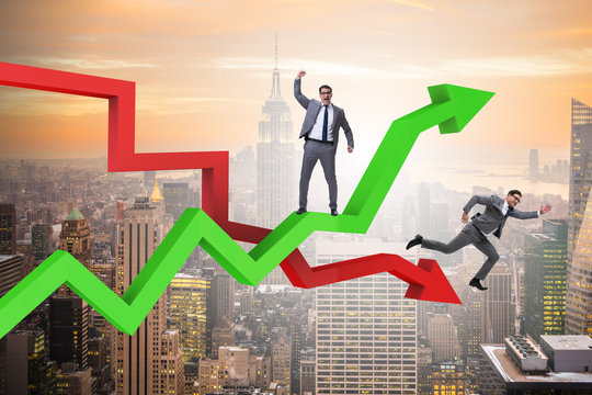 Businessman with charts of growth and decline