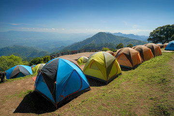 Camping tents on the top of mountain during sunrise at San pa kia to see Doi Luang Chiangdao, Chiang Mai, Thailand.
