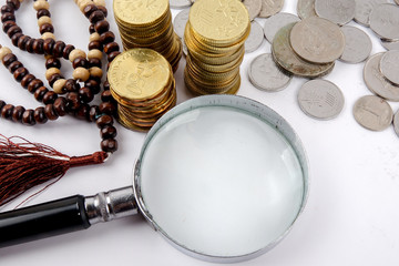 Rosary and coins. Islamic Banking/Finance concept.