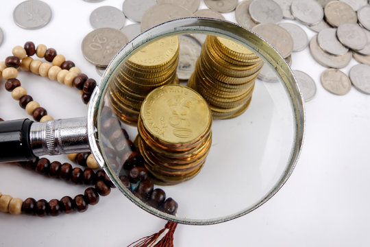 Rosary and coins. Islamic Banking/Finance concept.