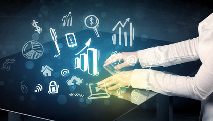 Man touching technology smart table with business icons