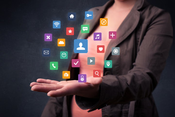 Woman holding colorful applications