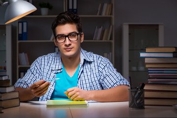 Student preparing for exams late night at home