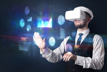 Man wearing VR goggles with charts and reports