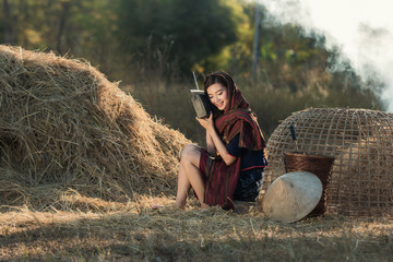 Naklejka na ściany i meble Lifestyle of Asian women in the field countryside thailand.