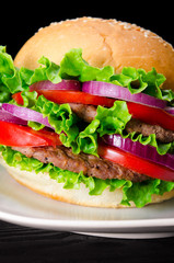Burger served in bun in nutrition fast food concept