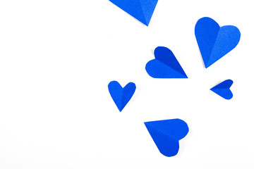 Origami paper heart blue color on white background.