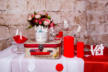 Table setting with lots of beautiful decoration. Interior for the celebration of St. Valentine's Day.