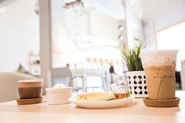 Breakfast - coffee with hot chocolate, pancakes on a white background.