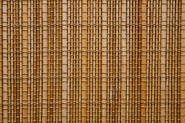 The texture of the bamboo mat of light shade filling the whole frame