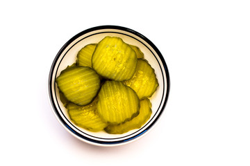 Closeup of a Bowl of Green Sliced Pickles