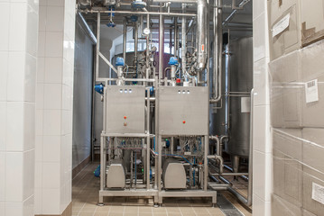 Stainless steel pipes in the factory. Construction on food production, Abstract industry background.