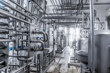 Stainless steel pipes in the factory. Construction on food production, Abstract industry background.
