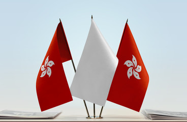 Two flags of Hong Kong with a white flag in the middle