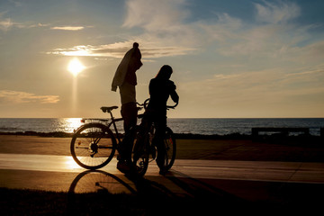Fototapeta premium Two bikers taking a break on the sunny beach