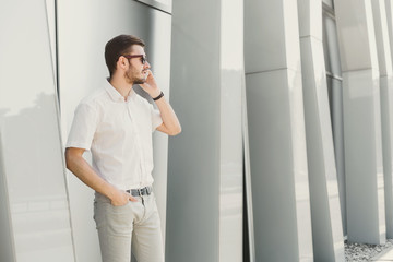 Confident businessman talking on phone