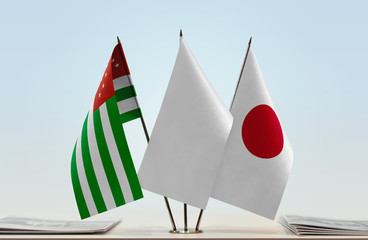 Flags of Abkhazia and Japan with a white flag in the middle