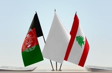 Flags of Afghanistan and Lebanon with a white flag in the middle