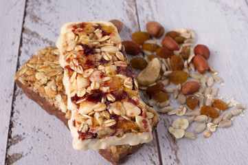 useful sweetness from nuts, oatmeal, honey, red berries, chocolate, raisins, dried apricots