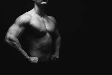 Obraz na płótnie Canvas Strong athletic man showes naked muscular body