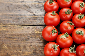 Cherry tomatoes on a brown background