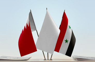 Flags of Bahrain and Syria with a white flag in the middle