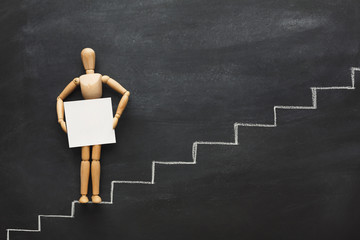 Wooden figure on drawn steps