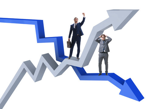 Businessman with charts of growth and decline