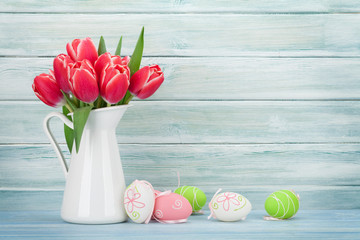 Red tulip flowers and easter eggs