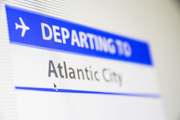 Computer screen close-up of status of flight departing to Atlantic City, New Jersey, USA