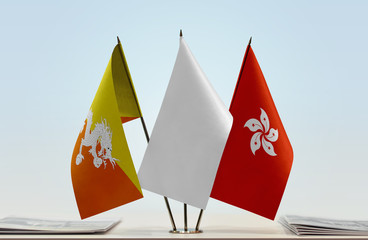 Flags of Bhutan and Hong Kong with a white flag in the middle