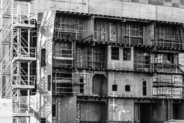 Gdansk shipyard, Poland. Retro style black and white. Cranes, old shipyard buildings, rusty structures.