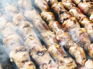 Skewers with chicken hearts on the grill. Close up shot
