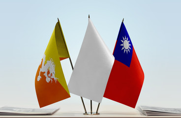 Flags of Bhutan and Taiwan with a white flag in the middle