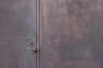 Dark grey background metallic garage door gate with red infernal color  and copy space