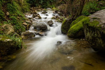 Slow shutter image of cascading mountain stream in Corsica