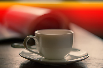 cup of coffee on the background of an open magazine.