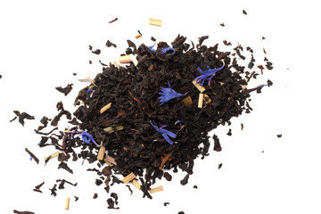 Aromatic black dry tea with petals isolated on white background top view