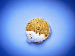 Bitcoin. Gold bitkoyn is extracted from the melted snow