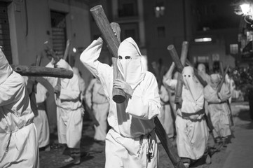 procession that takes place on Easter Friday in Civitavecchia, in Italy. There are men and women hooded in penitence