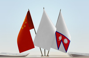 Flags of China and Nepal with a white flag in the middle