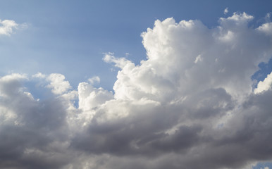 Sky with clouds and sunlight at sunset. colorful and cheerful, wallpaper or texture