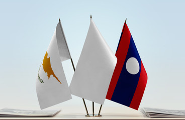 Flags of Cyprus and Laos with a white flag in the middle